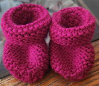 Knitted baby booties. 