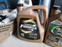 Unopened 5L jugs of motor oil