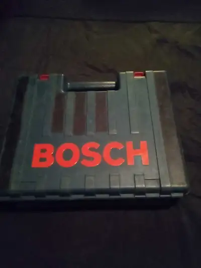 I am selling a used Bosch hammer drill, a powerful tool designed for drilling into hard materials li...