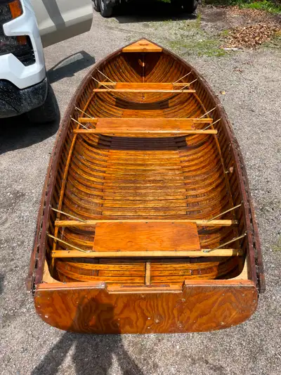 Antique cedar strip canoe. Inside refinished, outside needs fibreglass. Over $2000 to reach its curr...