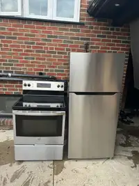 Almost BRAND NEW stainless steel fridge and stove set