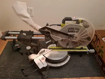 Ryobi Miter saw complete with carbide tipped blade. Four bolts fasten it to a sturdy metal saw-horse...