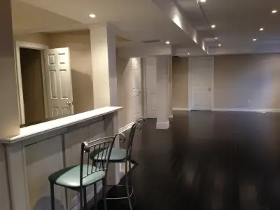 Walk out Basement apartment with fully sized windows and doors hardwood floors and backyard. In Stre...