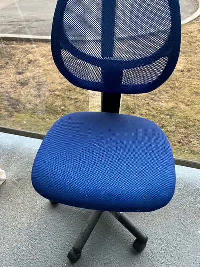 This is a used, yet still functional, blue mesh office chair, perfect for a student! The chair has a...