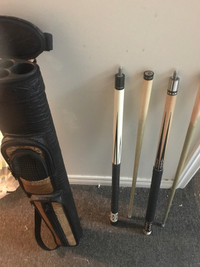Two pool cues plus case for sale 75$