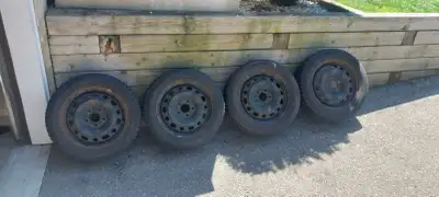 16" steel winter rims rims and mirage tires. Good tread left. 5x114.3 fits Mazdas amongst others 205...