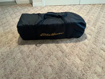 Eddie Bauer portable crib, playpen, and bassinette, that folds into a duffle style carry case. Cost...