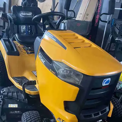 I'm selling a 2020 Cub Cadet riding lawnmower, model SLX54, powered by a robust 23.5 HP engine and e...