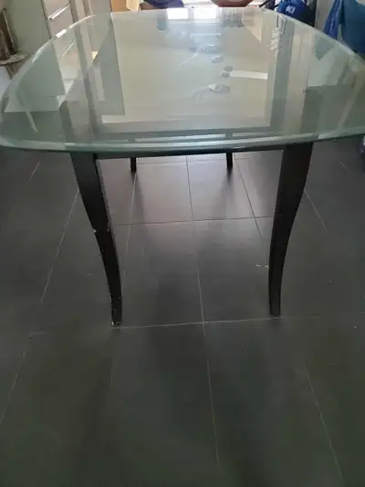 Glass dining table and wood frame asking for $40., View more