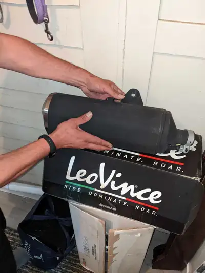 I am selling a used silent exhaust designed for a Kawasaki Ninja 400, offering enhanced performance...