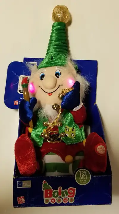 Elf, dances and lights up (cheeks, hat, etc) to music. Easy access on/off swicth in foot. NEW in box...