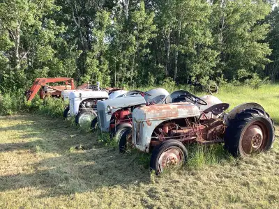 Five— 9N and 8N FORD Tractors All RAN WHEN PARKED 1 Extra Loader— some extra parts 1 J . D. A Row Cr...