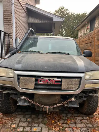 2004 GMC “Mud Truck” for sale $1400 OBO Comes with 4 extra tires, a tow rope and ownership. Runs, st...