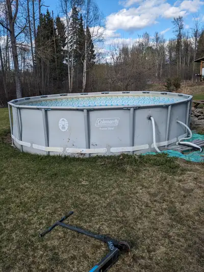 Coleman pool, 18 foot circle , 4 feet high. Includes several extras: chemicals, scoopers, solar pane...