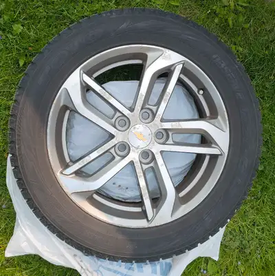 For sale is a set of four used Chevrolet rims with Toyo Observe GS13 winter tires, sized 235/55R18 1...