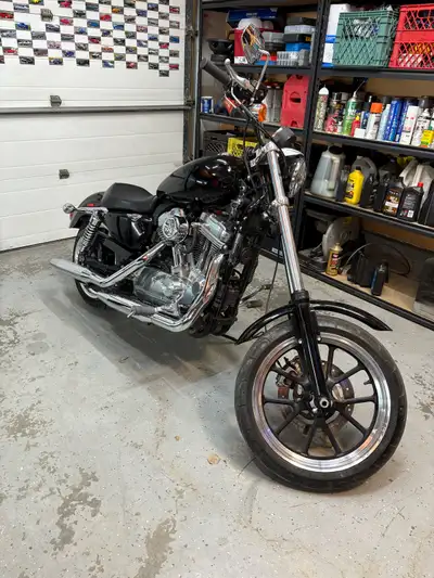 Selling my sportster. 23k kms on it Runs and drives great no issues whatsoever. Extended front forks...
