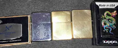 *Silver dollar on needs filled and new flint *2 brass ones need new flint, filled and one needs a wi...