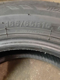 A set of four 185/ 65/ R15 tires with rims for Yaris and more