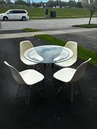 Rod iron glass table and 4 chairs 
