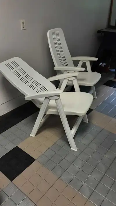 Chairs are white vinyl & are in excellant, clean condition, both for $ 40. Pick up in Chatham Ont