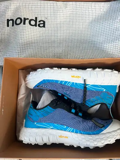 Still in the box never used Norda 001s. Size 10.5 men’s. Slightly too small for me. Absolutely wicke...