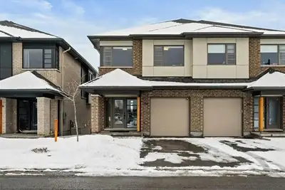 Welcome to this stunning 3-level semi-detached townhome in the highly sought-after Findlay Creek com...
