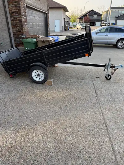 4x8 tilt bed trailer with removable sides and front one back. Message for more information.