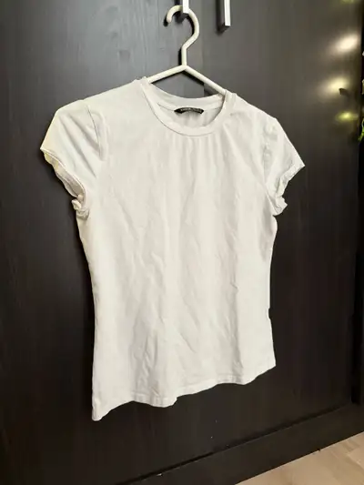 Basic white t-shirt. Easy to style and super comfy.