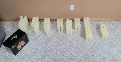 81 flameless candles Complete with matching remotes and vases All tested and working, batteries inst...
