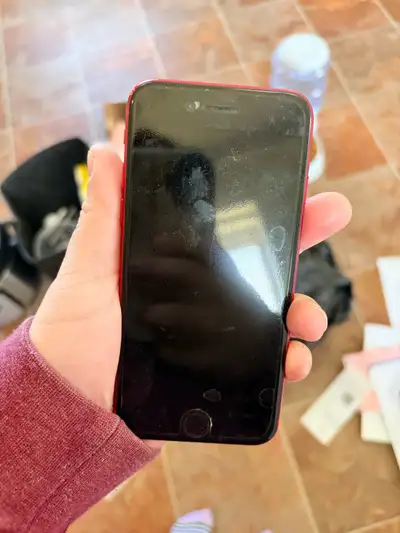 Selling a red iPhone in fair condition, ideal as a starter phone or for basic use. There are some si...