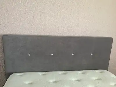 Modern queen-size bed frame with matching grey upholstered headboard featuring decorative crystal-st...