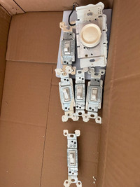 10 ish Leviton light switches and plate covers sold in a bundle
