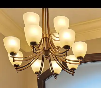 Two 12 Light Chandeliers. Very well made and taken care of. 8 lights in the bottom ring, 4 in the up...