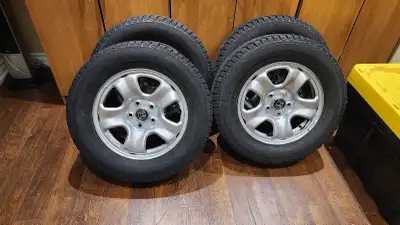 These are a set of four used Honda rims with Yokohama Ice Guard tires, sized at 215/70R16. They're i...
