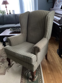 Wingback chair with cover.