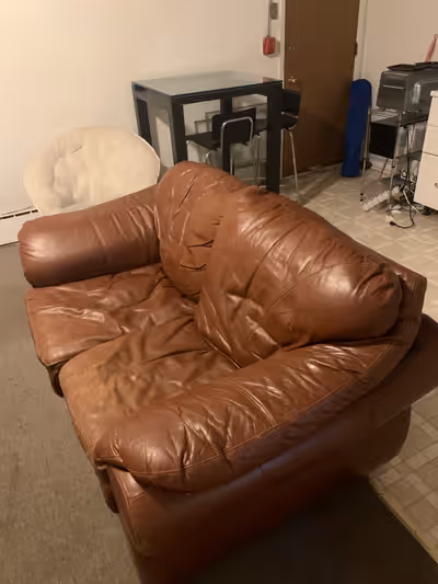 Slightly worn two person leather couch, need to get off my hands because I am moving out, price nego...