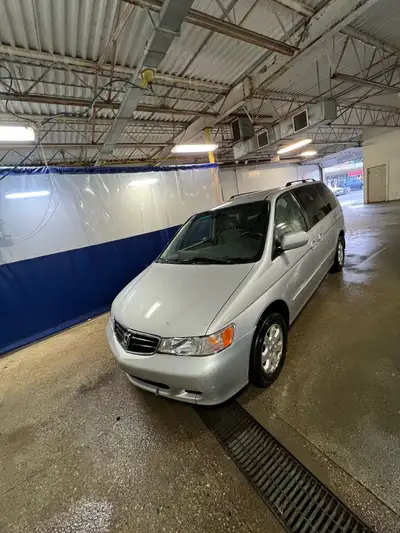 This is a used 2002 Honda Odyssey EX minivan, perfect for families. It has served us well. The van's...