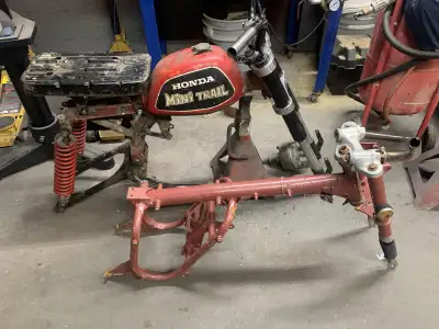 1976 z50 project,aftermarket forks,xr80 swing arm,older gas tank but it fits,front hub is there,new...