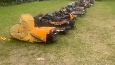 20 snow machines - all different makes & models (from Ski Daddler to John Deere) some in running con...