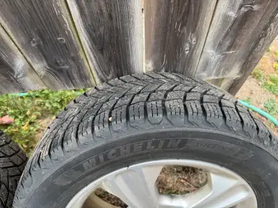 Like new, four Michelin X ICE tires 235/55 R17 with genuine Alloy Rims. Tires were used one winter s...