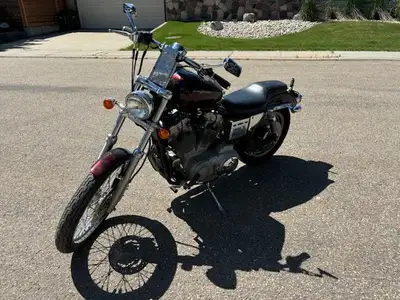 XL883cc converted to a 1200cc. Low kms. Custom paint job "wildfire red". Chrome plating and is in mi...