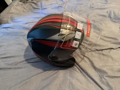This motorcycle helmet features a sleek black and red design, offering both style and safety for rid...