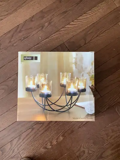 Metal Candle Holder. Holds 6 tea light Candles. In original box, never used. Would be a nice hostess...