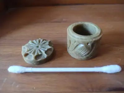 Tiny carved stone container and lid, View more
