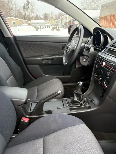 2008 Mazda 3 five speed with sunroof. Inspection is good till May 2027. Includes a set of all season...