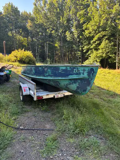 She’s got some dents, scratches, and couple patches but barely leaks a drop. Can fish all day and on...