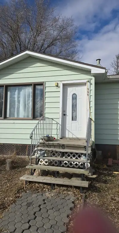 A cozy home features a living room with a large window 3beds 1bath basement is fully finishe .This h...
