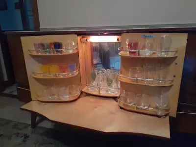 Made in England lighted "mini bar". Middle door opens up to display mirror and light. It has 3 drawe...