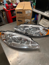 NOS 1998-2004 Chrysler intrepid headlights