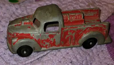 This is a vintage Hubley Kiddie Toy fire truck, showcasing a charming, weathered aesthetic that spea...
